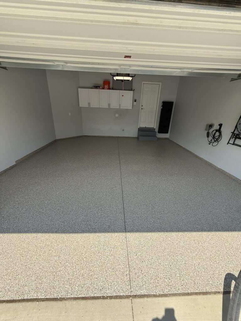 garage flake flooring in gray and tan with cove base